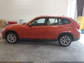 2014 BMW X1 — photo 14 of 16 | VIN WBAVL1C52EVY23174