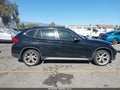 2013 BMW X1 — photo 13 of 16 | VIN WBAVM1C54DVW45750