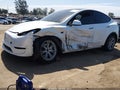 2023 Tesla Model Y — photo 2 of 15 | VIN 7SAYGDEE2PF669573