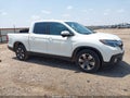 2017 Honda Ridgeline — photo 13 of 16 | VIN 5FPYK2F68HB011093