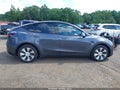 2023 Tesla Model Y — photo 13 of 19 | VIN 7SAYGDEE7PF694906