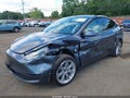2023 Tesla Model Y — photo 6 of 19 | VIN 7SAYGDEE7PF694906