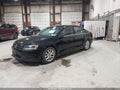 2014 Volkswagen Jetta — photo 2 of 14 | VIN 3VWB17AJ2EM432838
