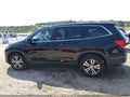 2018 Honda Pilot — photo 14 of 16 | VIN 5FNYF6H35JB073371
