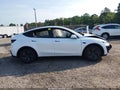 2026 Tesla Model Y — photo 11 of 14 | VIN 7SAYGDED0TA651412