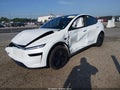 2026 Tesla Model Y — photo 2 of 14 | VIN 7SAYGDED0TA651412