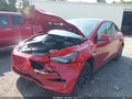 2023 Tesla Model Y — photo 2 of 14 | VIN 7SAYGDEE0PA198102