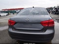 2014 Volkswagen Passat — photo 13 of 16 | VIN 1VWBP7A30EC001836
