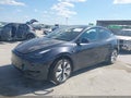 2024 Tesla Model Y — photo 2 of 20 | VIN 7SAYGDEE7RA243569