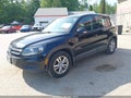 2014 Volkswagen Tiguan — photo 2 of 16 | VIN WVGBV3AXXEW518270