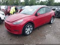 2023 Tesla Model Y — photo 2 of 14 | VIN 7SAYGDEE6PF692547