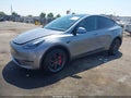 2025 Tesla Model Y — photo 2 of 15 | VIN 7SAYGDED6SF226326