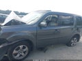 2013 Honda Pilot — photo 14 of 16 | VIN 5FNYF3H77DB030026