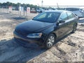 2014 Volkswagen Jetta — photo 2 of 17 | VIN 3VWD07AJ9EM439250