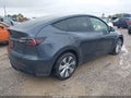 2022 Tesla Model Y — photo 4 of 15 | VIN 7SAYGDEE1NF455204