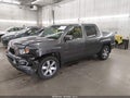 2011 Honda Ridgeline — photo 2 of 17 | VIN 5FPYK1F44BB010247