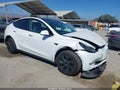2024 Tesla Model Y — photo 1 of 16 | VIN 7SAYGDEE0RF177627