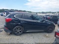 2018 BMW X1 — photo 13 of 16 | VIN WBXHU7C36J5H40247