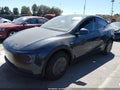 2026 Tesla Model Y — photo 2 of 17 | VIN 7SAYGDED7TA601137