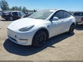 2022 Tesla Model Y — photo 2 of 14 | VIN 7SAYGDEE7NA010804
