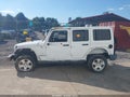 2011 Jeep Wrangler Unlimited — photo 13 of 15 | VIN 1J4BA5H17BL598101