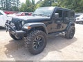 2019 Jeep Wrangler Unlimited — photo 2 of 18 | VIN 1C4HJXDG7KW579200