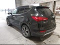 2015 Hyundai Santa Fe — photo 3 of 12 | VIN 5XYZU3LB2FG268528