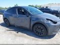 2023 Tesla Model Y — photo 6 of 16 | VIN 7SAYGDED4PF949695
