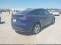 2023 Tesla Model Y — photo 4 of 16 | VIN 7SAYGDEE8PA199949