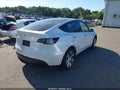 2023 Tesla Model Y — photo 4 of 20 | VIN 7SAYGAEE6PF692241