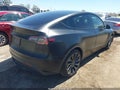 2022 Tesla Model Y — photo 4 of 15 | VIN 7SAYGDEF1NF523171