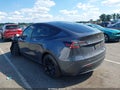 2023 Tesla Model Y — photo 3 of 15 | VIN 7SAYGAEE4PF827720