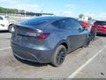 2023 Tesla Model Y — photo 4 of 15 | VIN 7SAYGAEE4PF827720