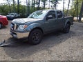 2009 Nissan Frontier — photo 2 of 15 | VIN 1N6AD07U39C411645