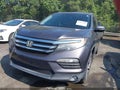 2018 Honda Pilot — photo 12 of 16 | VIN 5FNYF6H91JB061397