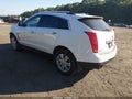2016 Cadillac SRX — photo 2 of 15 | VIN 3GYFNEE39GS522926