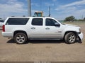 2012 Chevrolet Suburban — photo 14 of 17 | VIN 1GNSCJE06CR140074