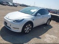 2022 Tesla Model Y — photo 2 of 15 | VIN 7SAYGAEE0NF401570