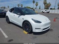 2023 Tesla Model Y — photo 1 of 18 | VIN 7SAYGDEF3PF740868