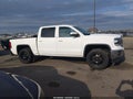 2014 GMC Sierra 1500 — photo 13 of 16 | VIN 3GTU2UEC2EG325953
