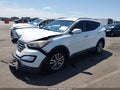 2014 Hyundai Santa Fe — photo 2 of 15 | VIN 5XYZU3LA3EG132785