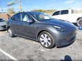 2023 Tesla Model Y — photo 1 of 20 | VIN 7SAYGDEE2PF879297