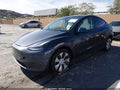 2023 Tesla Model Y — photo 2 of 20 | VIN 7SAYGDEE2PF879297
