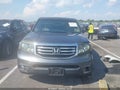 2012 Honda Pilot — photo 12 of 16 | VIN 5FNYF4H57CB011995