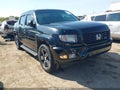 2014 Honda Ridgeline — photo 1 of 16 | VIN 5FPYK1F77EB011794