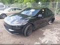 2026 Tesla Model Y — photo 2 of 14 | VIN 7SAYGDEE9TF552728