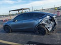 2026 Tesla Model Y — photo 12 of 14 | VIN 7SAYGDED9TA477971
