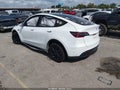 2022 Tesla Model Y — photo 3 of 15 | VIN 7SAYGAEE5NF400429