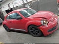 2012 Volkswagen Beetle — photo 13 of 16 | VIN 3VWFP7AT9CM616141