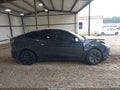 2024 Tesla Model Y — photo 12 of 15 | VIN 7SAYGDEE8RF208848